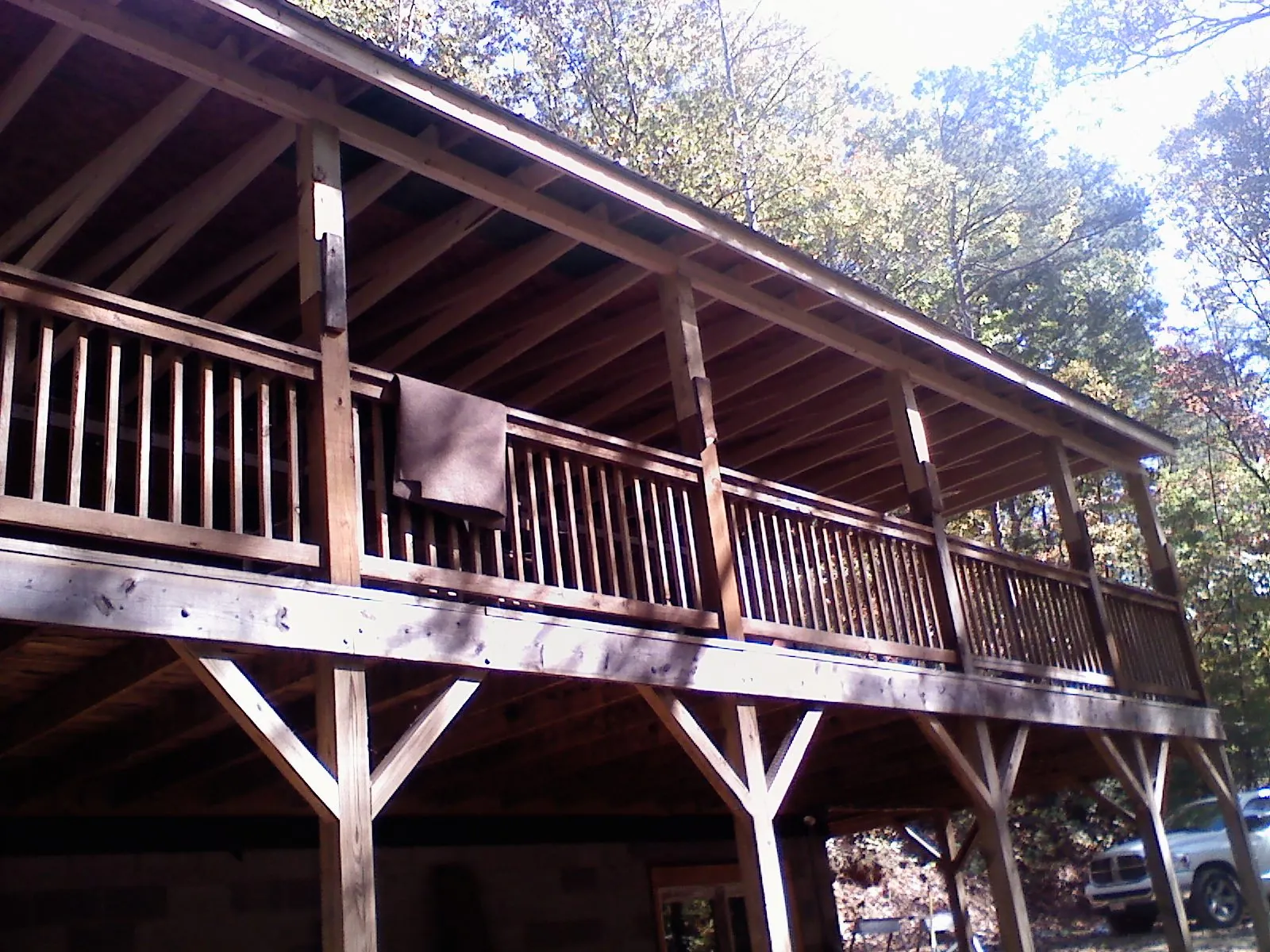 Timber framing under a new elevated porch and deck — Roof Leak Repair in Weatherford by Roofing Brothers