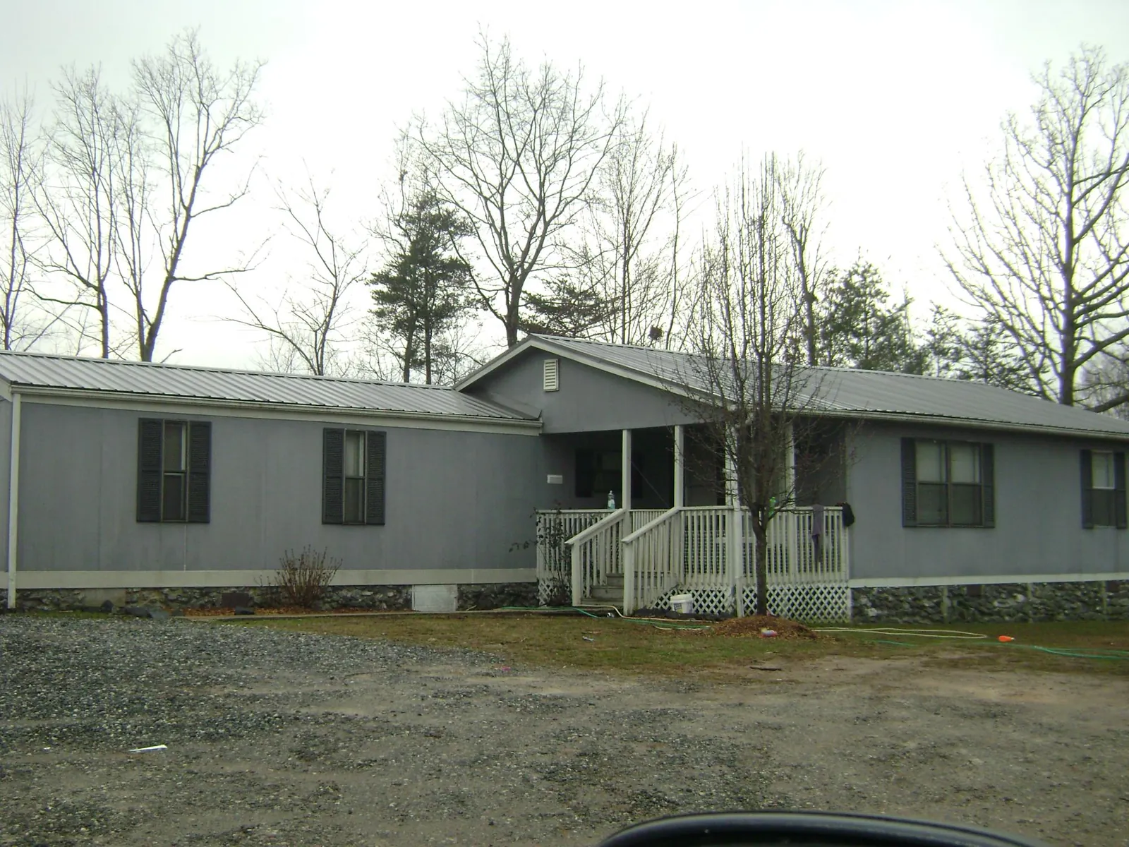 Metal roof over a manufactured home with a covered front porch in Weatherford